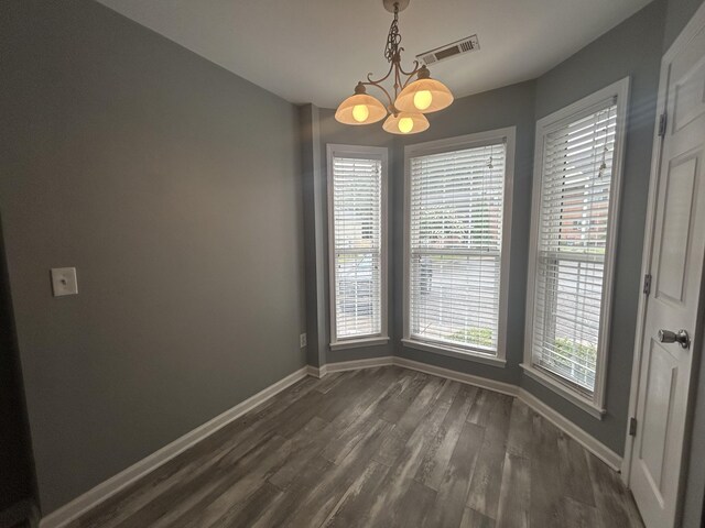 7206 Rosemary Ct, Fairview, TN 37062 - unfurnished dining area featuring a chandelier and dark wood finished floors