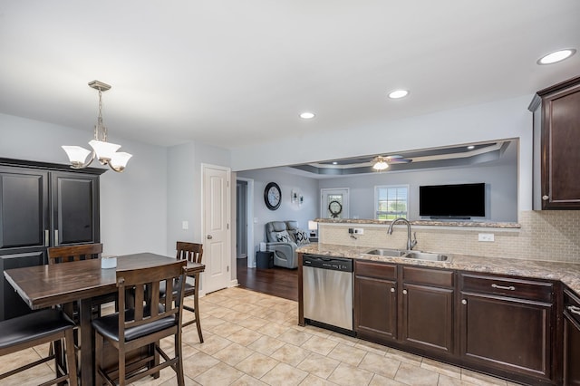 4611 Turquoise Ln, Murfreesboro, TN 37129 - kitchen featuring stainless steel dishwasher, ceiling fan, backsplash, dark brown cabinets, and light stone counters