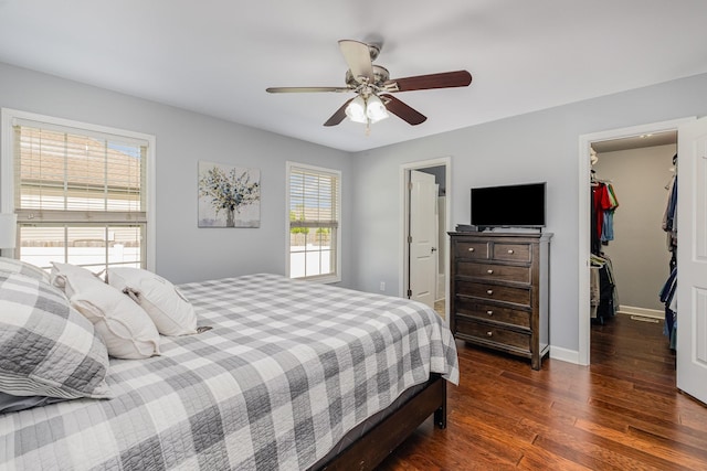 4611 Turquoise Ln, Murfreesboro, TN 37129 - bedroom featuring a walk in closet, wood finished floors, a closet, and a ceiling fan