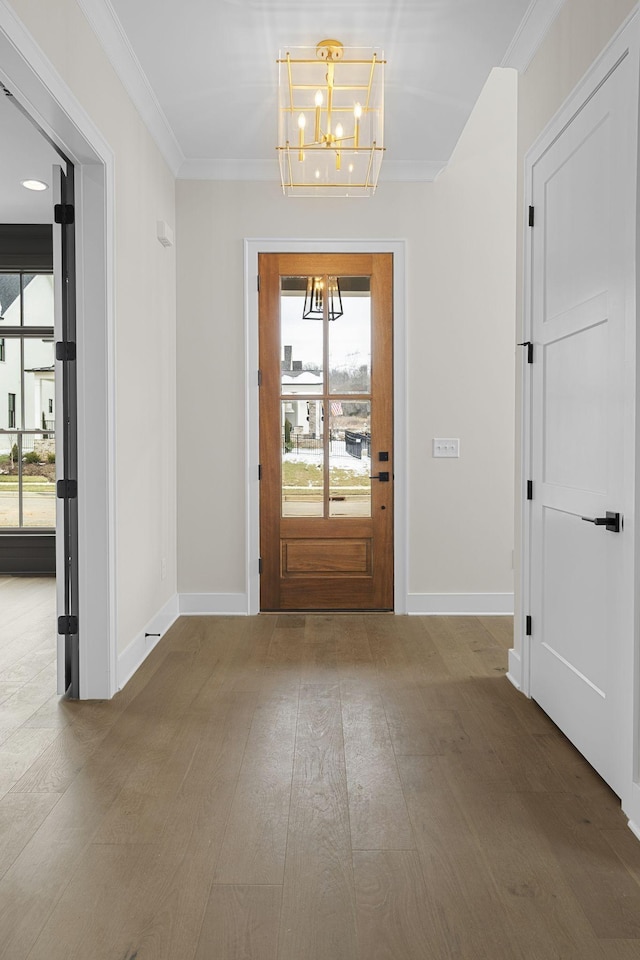 8011 Cane Creek Rd, Nashville, TN 37221 - foyer with a chandelier, healthy amount of natural light, ornamental molding, and wood finished floors