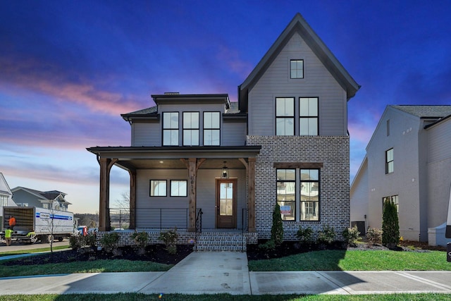 8011 Cane Creek Rd, Nashville, TN 37221 - view of front facade with covered porch and brick siding