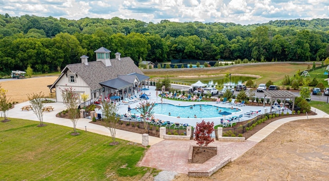 8011 Cane Creek Rd, Nashville, TN 37221 - community pool with a yard, a view of trees, and a water view