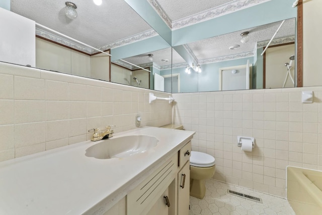 123 Proffitt St, Carthage, TN 37030 - bathroom featuring tile walls, a textured ceiling, a shower, tile patterned flooring, and vanity