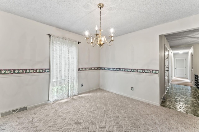 123 Proffitt St, Carthage, TN 37030 - carpeted empty room with a chandelier and a textured ceiling