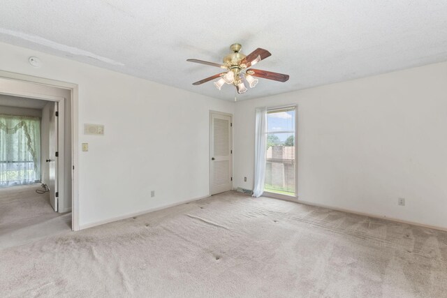 123 Proffitt St, Carthage, TN 37030 - spare room featuring carpet floors, a ceiling fan, and a textured ceiling