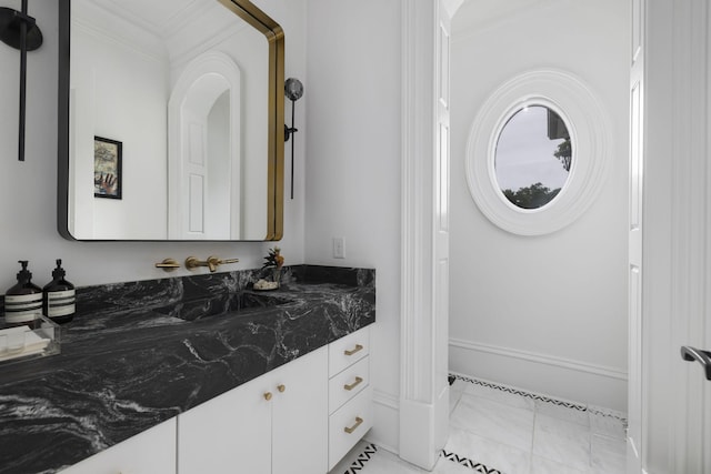 2410 Hidden River Ln, Franklin, TN 37069 - bathroom with crown molding, marble look tile flooring, and vanity