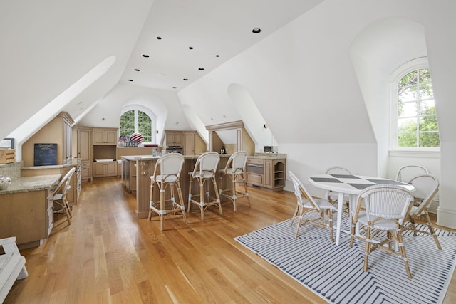 2410 Hidden River Ln, Franklin, TN 37069 - dining space with vaulted ceiling, plenty of natural light, and light wood-style floors
