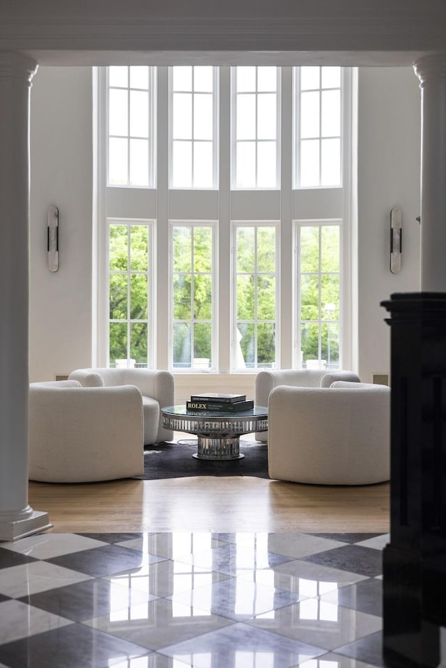 2410 Hidden River Ln, Franklin, TN 37069 - living room with decorative columns, plenty of natural light, and a high ceiling