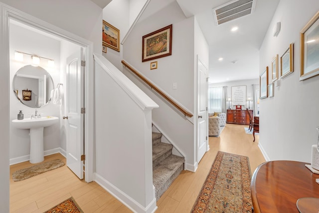 127 Millbrook Dr, Spring Hill, TN 37174 - hallway with light wood-style flooring, stairs, and recessed lighting
