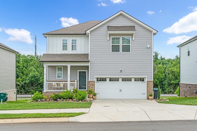 127 Millbrook Dr, Spring Hill, TN 37174 - view of front of home featuring board and batten siding, a garage, driveway, a porch, and roof with shingles
