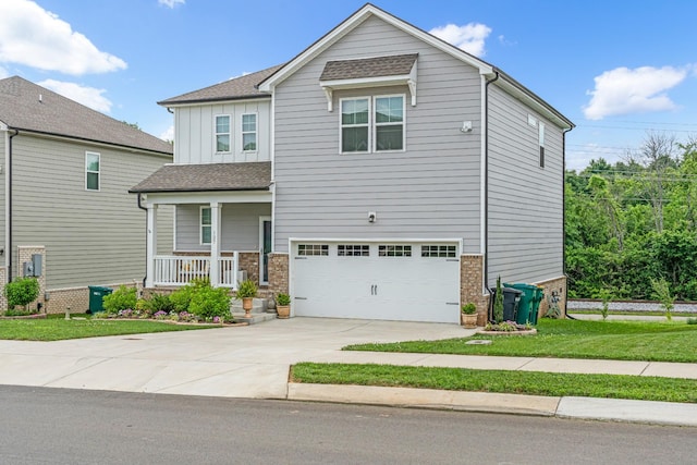 127 Millbrook Dr, Spring Hill, TN 37174 - craftsman-style home featuring a porch, a garage, concrete driveway, board and batten siding, and a front lawn