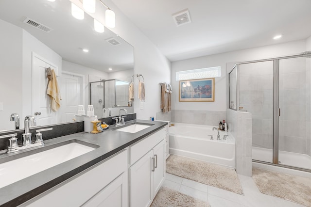 127 Millbrook Dr, Spring Hill, TN 37174 - full bath featuring a stall shower, tile patterned flooring, a garden tub, double vanity, and recessed lighting