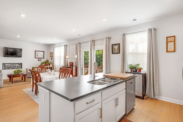 127 Millbrook Dr, Spring Hill, TN 37174 - kitchen with light wood finished floors, dishwasher, a kitchen island with sink, white cabinetry, and recessed lighting