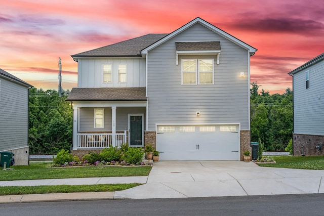 127 Millbrook Dr, Spring Hill, TN 37174 - view of front facade with board and batten siding, a porch, a garage, and a shingled roof