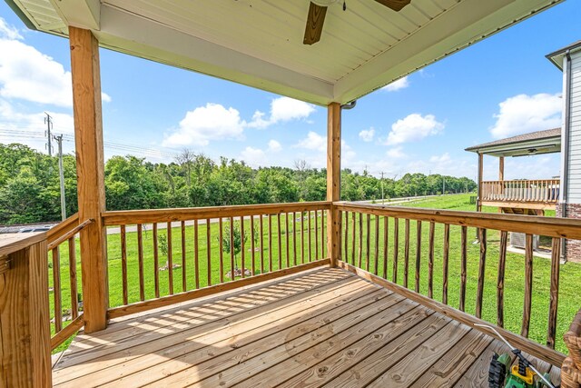 127 Millbrook Dr, Spring Hill, TN 37174 - wooden deck with a ceiling fan, a lawn, and view of scattered trees
