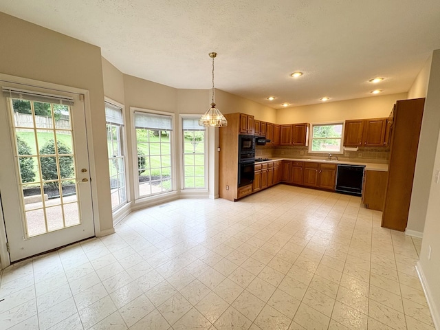 416 Barnes Dr, Lebanon, TN 37087 - kitchen featuring black appliances, brown cabinets, backsplash, light countertops, and decorative light fixtures