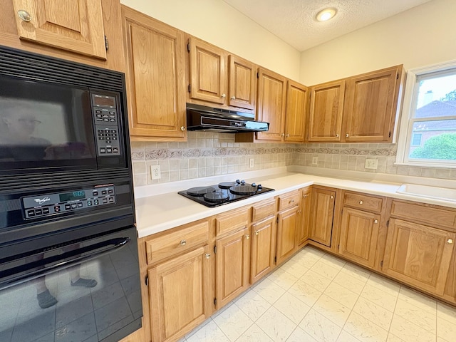 416 Barnes Dr, Lebanon, TN 37087 - kitchen with black appliances, under cabinet range hood, light countertops, backsplash, and a textured ceiling