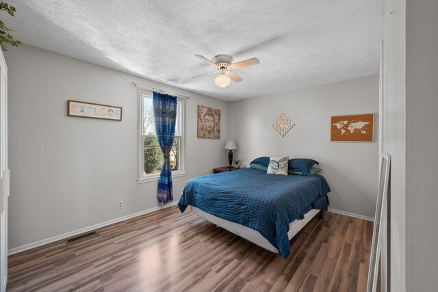 301 Panamint Dr, Antioch, TN 37013 - bedroom featuring a textured ceiling, wood finished floors, and a ceiling fan