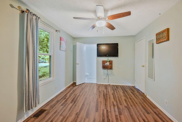 301 Panamint Dr, Antioch, TN 37013 - unfurnished living room with wood finished floors and a ceiling fan