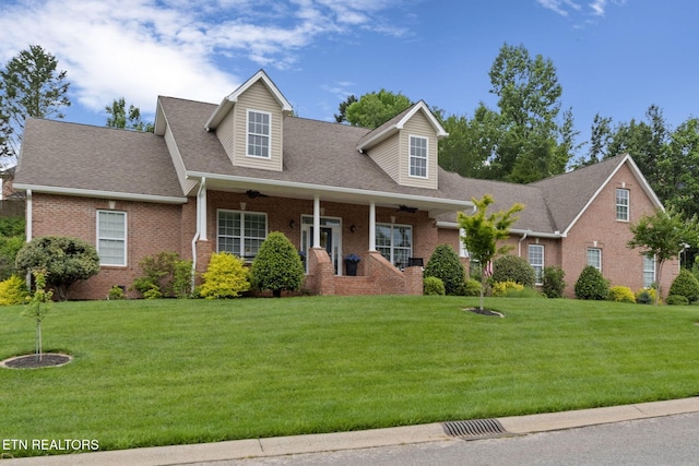 48 Riverside Dr, Oak Ridge, TN 37830 - cape cod-style house with brick siding, a front yard, and ceiling fan