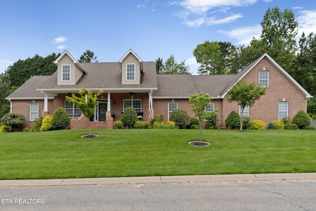 48 Riverside Dr, Oak Ridge, TN 37830 - view of front of house with brick siding, a front yard, and a porch