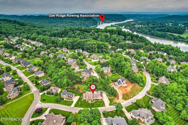 48 Riverside Dr, Oak Ridge, TN 37830 - aerial perspective of suburban area featuring a nearby body of water and a heavily wooded area