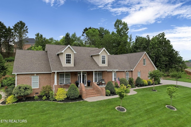 48 Riverside Dr, Oak Ridge, TN 37830 - cape cod house featuring brick siding, a porch, a front lawn, a shingled roof, and crawl space