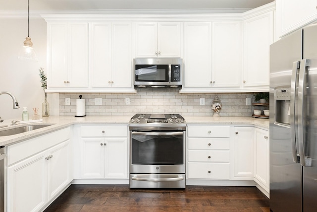 1055 Beckwith St, Franklin, TN 37064 - kitchen featuring stainless steel appliances, backsplash, white cabinets, and light stone countertops