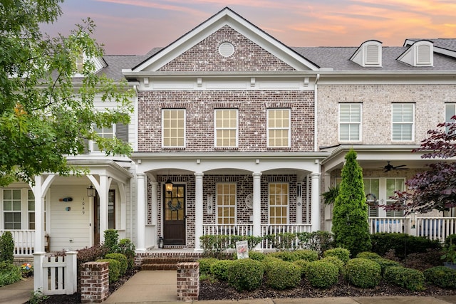 1055 Beckwith St, Franklin, TN 37064 - view of front of house featuring covered porch, brick siding, and a ceiling fan