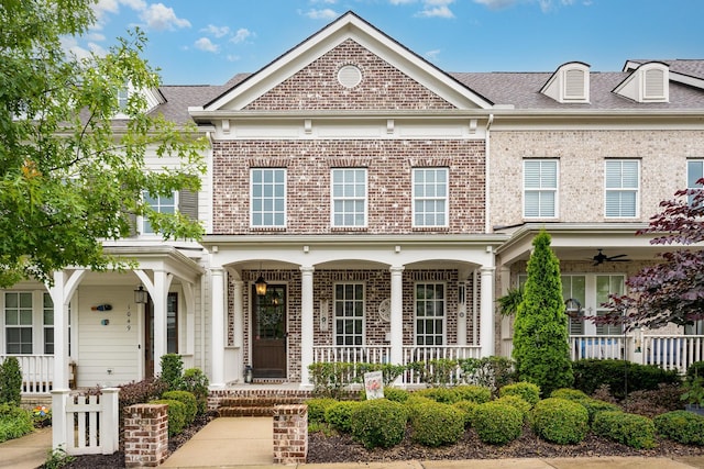 1055 Beckwith St, Franklin, TN 37064 - view of front facade with a porch, brick siding, a ceiling fan, and a shingled roof