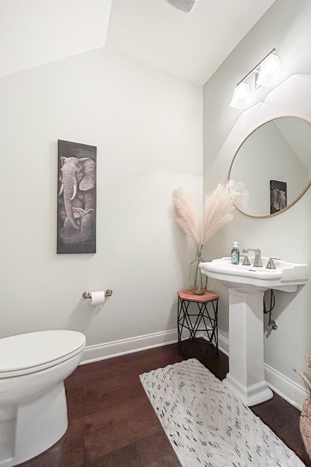 1055 Beckwith St, Franklin, TN 37064 - half bathroom featuring toilet and wood finished floors