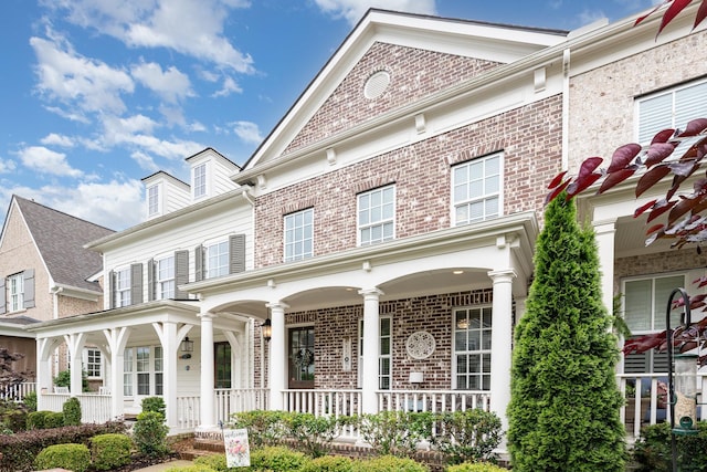 1055 Beckwith St, Franklin, TN 37064 - view of front of home featuring a porch and brick siding