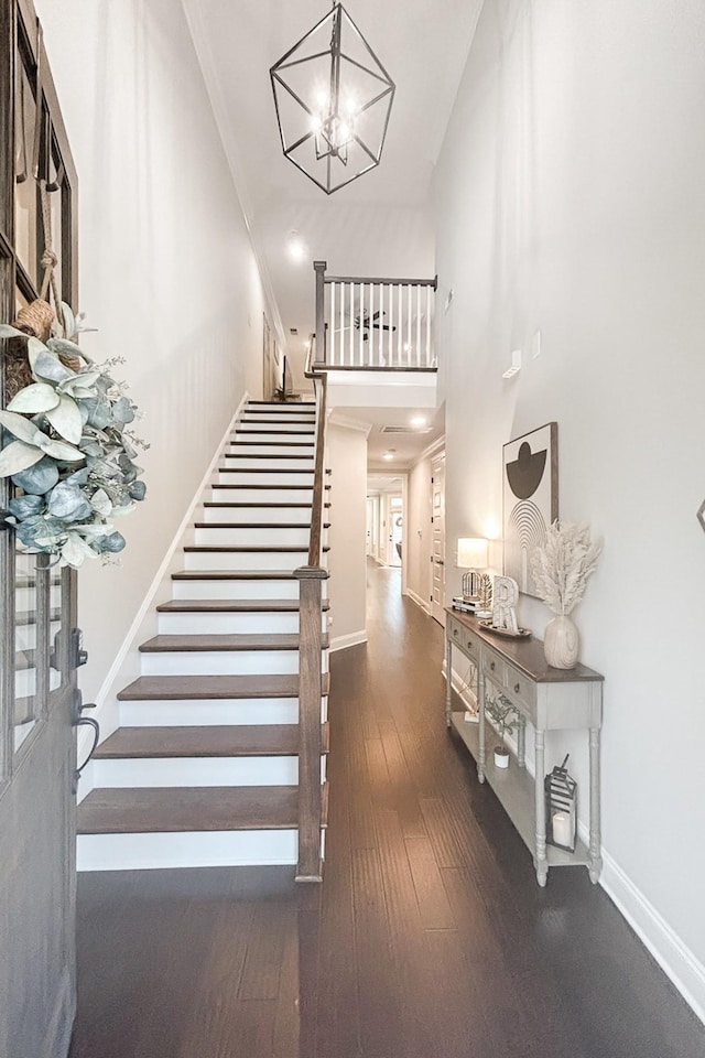 1055 Beckwith St, Franklin, TN 37064 - stairs with a chandelier, a towering ceiling, and hardwood / wood-style flooring