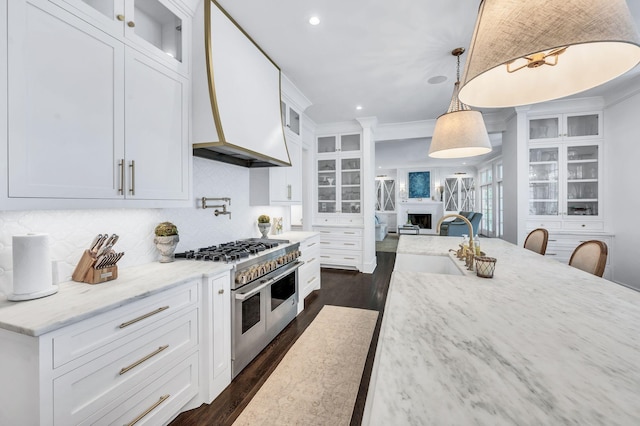 1932 Rosewood Valley Dr, Brentwood, TN 37027 - kitchen featuring range with two ovens, dark wood-style flooring, white cabinets, tasteful backsplash, and recessed lighting