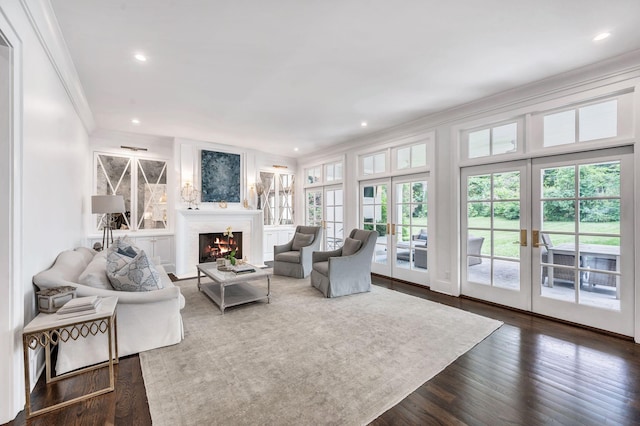 1932 Rosewood Valley Dr, Brentwood, TN 37027 - living room featuring french doors, ornamental molding, a fireplace with flush hearth, recessed lighting, and dark wood-style flooring
