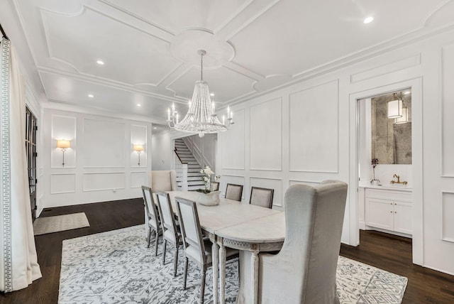 1932 Rosewood Valley Dr, Brentwood, TN 37027 - dining area featuring a decorative wall, stairway, a chandelier, dark wood-style flooring, and crown molding