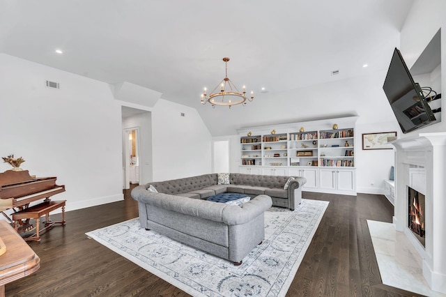1932 Rosewood Valley Dr, Brentwood, TN 37027 - living area with a chandelier, dark wood-style floors, vaulted ceiling, a fireplace with flush hearth, and recessed lighting