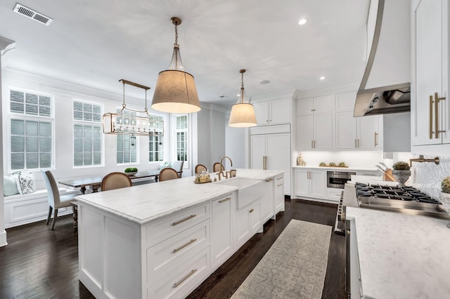 1932 Rosewood Valley Dr, Brentwood, TN 37027 - kitchen featuring custom range hood, recessed lighting, dark wood-style flooring, a kitchen island with sink, and white cabinetry