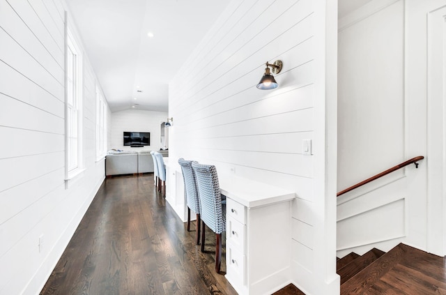 1932 Rosewood Valley Dr, Brentwood, TN 37027 - hallway with dark wood-style flooring, wooden walls, and a desk