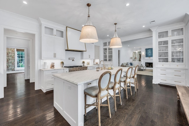 1932 Rosewood Valley Dr, Brentwood, TN 37027 - kitchen featuring recessed lighting, crown molding, white cabinetry, custom exhaust hood, and dark wood-style floors