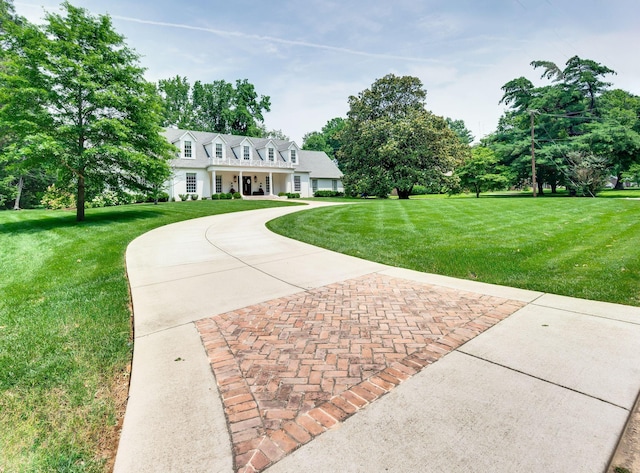 1932 Rosewood Valley Dr, Brentwood, TN 37027 - cape cod house featuring a front lawn, decorative driveway, and a garage