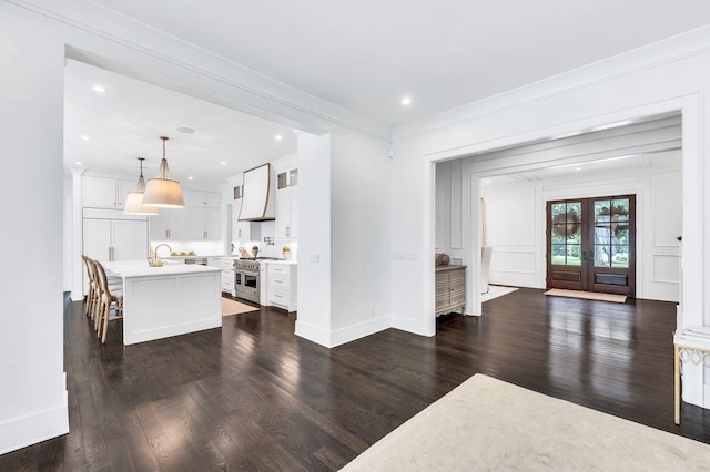 1932 Rosewood Valley Dr, Brentwood, TN 37027 - living area featuring dark wood finished floors, recessed lighting, and ornamental molding