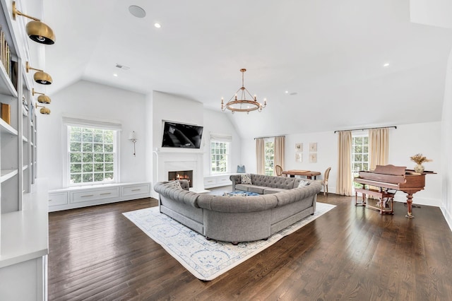 1932 Rosewood Valley Dr, Brentwood, TN 37027 - living room featuring vaulted ceiling, a warm lit fireplace, a chandelier, dark wood-style floors, and recessed lighting