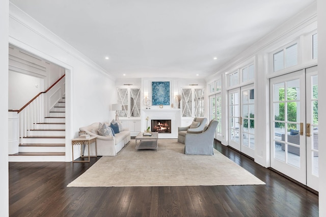 1932 Rosewood Valley Dr, Brentwood, TN 37027 - living area with french doors, dark wood-type flooring, a lit fireplace, crown molding, and stairway