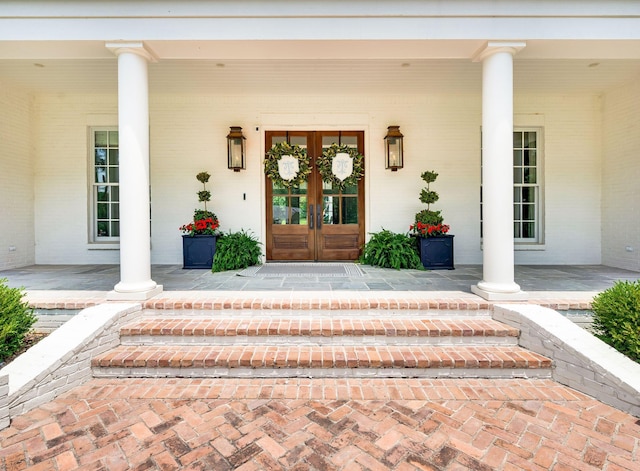 1932 Rosewood Valley Dr, Brentwood, TN 37027 - entrance to property with covered porch, french doors, and brick siding