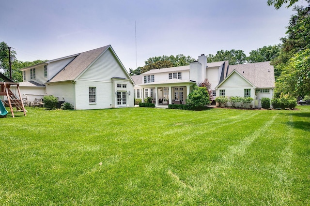 1932 Rosewood Valley Dr, Brentwood, TN 37027 - back of house with french doors, a lawn, and a playground