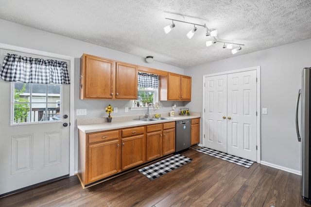 113 Beck Ct, Murfreesboro, TN 37128 - kitchen with appliances with stainless steel finishes, light countertops, dark wood finished floors, a textured ceiling, and brown cabinets
