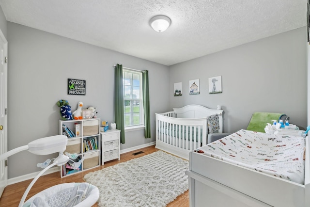 113 Beck Ct, Murfreesboro, TN 37128 - bedroom featuring wood finished floors and a textured ceiling
