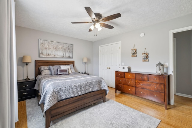 113 Beck Ct, Murfreesboro, TN 37128 - bedroom with wood finished floors, a closet, ceiling fan, and a textured ceiling
