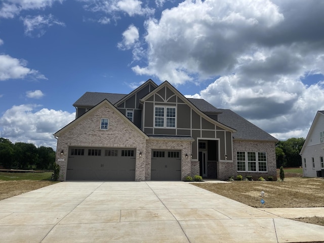 5969 Hunt Valley Dr, Spring Hill, TN 37174 - view of front of property featuring concrete driveway, brick siding, and a shingled roof